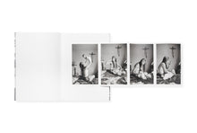 Load image into Gallery viewer, Gatefold showing a sequence of four photos of a young woman with her infant,  holding the child aloft on a bed with a crucifix on the wall behind them. 
